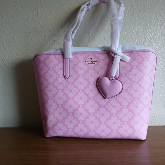 kate spade Handbags - Kate Spade Pink Floral Tote with Heart Charm
